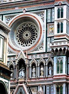 an ornate building with many windows and statues