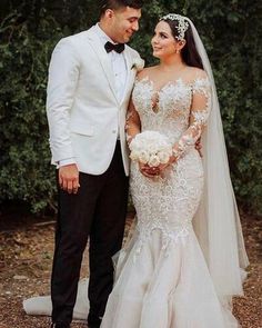 a bride and groom posing for a photo