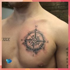 a man with a compass tattoo on his chest