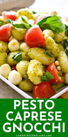 pesto caprese gnocchi salad with tomatoes and basil on the side