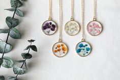 "New design of pressed baby's breath resin necklace. 14K gold plated brass chain and bezel. Pendant diameter: 0.98\"(25mm) Chain options: 14k gold plated brass chain, length: 16\"+2\" extender. 14k gold filled chain, 18 inches. Color: white, blue, purple, orange, pink. Come with handcraft gift box, beautiful gift for your loved one. Free shipping on order over 35( U.S. only)" Gold Sterling Silver Necklaces With Pressed Flowers, Gold Sterling Silver Necklace With Pressed Flowers, Botanical Jewelry With Pressed Flowers, Delicate Handmade Yellow Gold Charm Necklace, Flower Charm Necklaces With Pressed Flowers, Dainty Flower Necklace With Pressed Flowers, Dainty Pressed Flower Necklace For Mother's Day, Gold Pendant Jewelry With Pressed Flowers, Handmade 14k Gold Filled Necklaces For Wedding