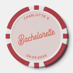 a red and white poker chip with the name charlotte's bachelor written on it