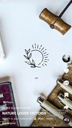 the logo for nature lover tattoos is displayed on a white surface with other items around it