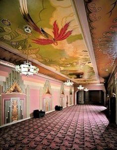 an empty ballroom with chandeliers and paintings on the ceiling