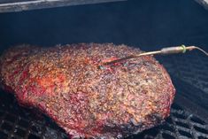 a steak is being cooked on the grill