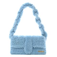 This is an authentic JACQUEMUS Shearling Le Bambidou in Light Blue. This bag is finely crafted in blue shearling fur. It features a braided shearling shoulder strap and opens to a beige fabric interior with a patch pocket. Beige Fabric, Patch Pocket, Calf Skin, Light Pink, Dust Bag, Shoulder Strap, Light Blue, Turquoise, Fabric