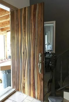 the door is made out of wood and has wavy lines painted on it's side