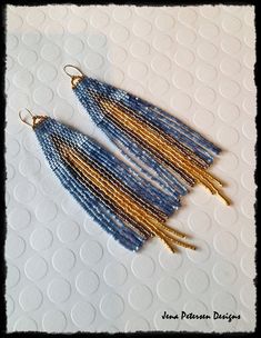 $2.00 SHIPPING      ARTISTIC 3-COLOR FRINGE EARRINGS...Glittery Silky Satin Blue is the featured color in these beauties. The silky beads change color intensity as the light bounces from bead to bead.  The blue satin beads surround a Dark Silver river of beads with the 24k Gold beads spilling out the middle... almost like a river of golden lava.  I only use premium Japanese seed beads for my earrings, and I hand make the 14k Gold Filled ear wires. Wear these during the day with a t-shirt and jeans, or with your best velvet attire for your next night out! MEASUREMENTS:  LENGTH - about 4  ½" measured from the top of the ear wire.  WIDTH -  1" wide at the widest point.  $2.00 SHIPPING Ships to you from my studio in Northern California! Please see shipping times below.  Your earrings arrive se Bohemian Blue Earrings With Gold Beads, Beaded Fringe Earrings, Mixed Metal Earrings, Buy Earrings, Festival Jewelry, Earrings Bohemian, Earrings Beaded, Hippie Jewelry, Beaded Fringe