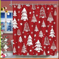 a red shower curtain with white christmas trees and snowflakes on it in front of a window