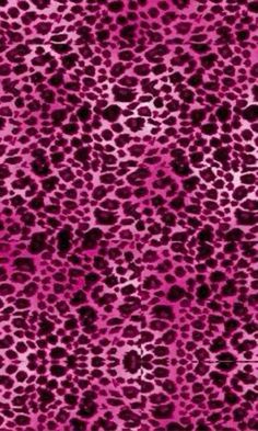 a pink and black animal print fabric with lots of small spots on it's surface