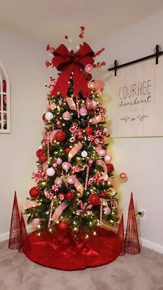 a christmas tree decorated with candy canes and bows