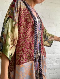 This is colourful, light oversized silk kimono shirt  patchwork of different vintage silk materials  very soft and flowy  made for both men and woman  nice looking with skirt as well as trousers or shorts, can be used all year round, as a cover up layered over a long sleeve  super comfy, hippie boho style, great for summer festivals, travels, or every day MEASURE free size MATERIAL *silk More boho style ideas at  https://www.etsy.com/shop/AltheaStores Thank you for looking Silk Patchwork Long Sleeve Kimono, Silk Kimono With Patchwork, Silk Long Sleeve Kimono With Patchwork, Long Sleeve Silk Kimono With Patchwork, Oversized Silk Kimono With Long Sleeves, Oversized Silk Bohemian Kimono, Oversized Silk Long Sleeve Kimono, Boho Vintage Clothing, Bronze Blouse