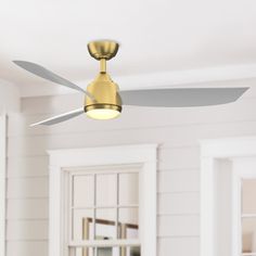 a ceiling fan in a room with white walls