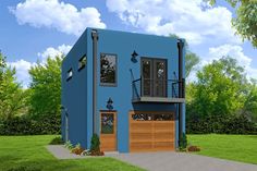 a blue house with two garages on the front and one above it's door