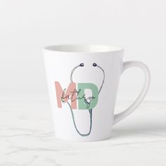 a white coffee cup with a stethoscope and the words med on it