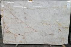 a white marble counter top sitting in a room