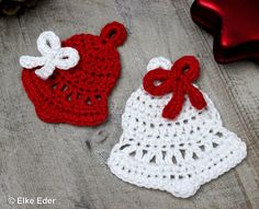 two crocheted baby hats with bows on the top one is red and white