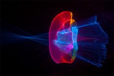 an image of a colorful object that looks like it is floating in the air with light