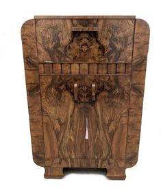 a wooden cabinet with an animal design on the front and side panels, inlaid to it's body