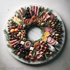 a platter filled with different types of meats, cheeses and nuts on top of a marble surface