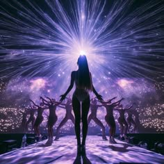 a woman standing in front of a stage with lights and stars on the sky behind her