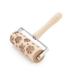 a wooden rolling pin with floral design on the front and handle, set against a white background