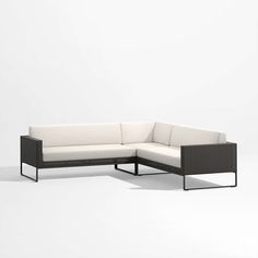 a black and white couch sitting on top of a white floor