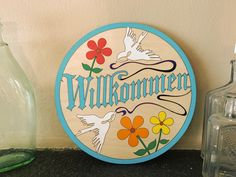 there is a sign that says willkommen on the side of a wall