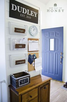 an image of a blue door and some signs on the wall