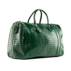 Tote&Carry Emerald Green Apollo 2 Faux Crocodile Skin Duffle Bag Designed in the USA and handcrafted with vegan alligator skin leather. This urban luxury duffle is stylish, functional, and made with high-quality details. Our luxury duffle is covered in eco-styled, full-grain alligator skin that pairs vegan leather and gold zipper accents with pops of standout color. The design is in the details of our affordable luxury travel bags. Green Leather Satchel With Crocodile Pattern, Classic Green Crocodile Pattern Bag, Green Leather Bag With Crocodile Pattern, Green Leather Duffle Bag With Luggage Sleeve, Green Textured Leather Bag For Errands, Green Textured Leather Bag For On-the-go, Luxury Green Travel Bag For Daily Use, Modern Travel Bags With Crocodile Pattern, Bff Travel