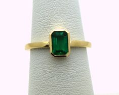 Classy Minimalist Ring in 14KT yellow gold, stunning 0.60ctor bigger natural Colombian emerald center, the ring is made for all the lovers of minimalistic rings!! Once the order is placed we will send you choices for center stone and you can choose your own emerald in the same setting style! Details of the ring: Metal: 14KT rose/white or yellow gold Center name: Emerald Center type: Gemstone Remarks: Natural emerald-not treated Center Weight: 0.60ct or bigger Center Cut: Very Good Center Clarity Fine Jewelry Emerald Cut Yellow Gold Emerald Ring, Yellow Gold Hallmarked Emerald Cut Ring, Yellow Gold Emerald Cut Ring Hallmarked, Minimalist Emerald Ring For Formal Occasions, Solitaire Emerald Ring In Yellow Gold, May Birthstone, Yellow Gold Solitaire Emerald Ring, May Birthstone, Yellow Gold Solitaire Emerald Ring For May Birthstone, 14k Yellow Gold Emerald-cut Ring, Fine Jewelry Solitaire Yellow Gold Emerald Ring