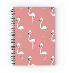 a spiral notebook with pink flamingos on it