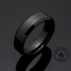 a black ceramic ring is shown against a dark background with the words, rings for men's and women's wear