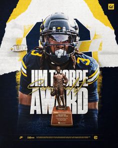 a football player holding a trophy in front of a poster that says, i'm to be award