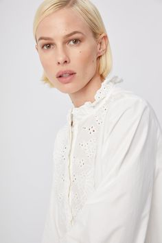 With lace embroidery details and in our favorite new slick cotton stretch, we think the Aviara is a fresh take on a basic popover.  Slightly cropped and a line.

  
 * Imported 
 * Cotton 
 * Powered by our patented No Gape® button technology
  
 * Model is 5'11" and is wearing a size small Spring Cropped Top With Broderie Anglaise, White Relaxed Fit Eyelet Top, Chic Cotton Blouse With Cutwork Hem, White Feminine Top With Cutwork Hem, White Long Sleeve Tops With Cutwork Hem, Feminine Spring Top With Cutwork Hem, Feminine Spring Tops With Cutwork Hem, Relaxed Fit Eyelet Tops For Daywear, Eyelet Tops With Relaxed Fit For Daywear