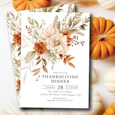 a thanksgiving dinner party with pumpkins and flowers