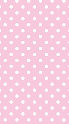 a pink background with white polka dots