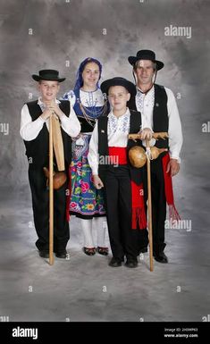 a family dressed in traditional german costumes posing for a photo - stock image