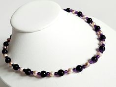 This beautiful necklace features round Amethyst beads in two sizes and 100% natural Lavender coloured Freshwater Pearls. The beads and Pearls are threaded on nylon coated 7 strand stainless steel beading wire, it's finished off with a 925 Sterling SIlver Lobster clasp and a two inch extender chain. Single Strand Purple Beads For Gift, Purple Single Strand Beads For Gift, Purple Single Strand Beads As A Gift, Gift Purple Single Strand Beaded Necklace, Purple Single Strand Beaded Necklace Gift, Purple Single Strand Beaded Necklace For Gift, Lavender Single Strand Round Bead Jewelry, Adjustable Faceted Bead Pearl Necklace, Lavender Single Strand Jewelry With Round Beads