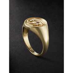 Jacquie Aiche's 'Eye of Horus' signet ring is engraved with an image of the ancient Egyptian symbol, which is believed to promote well-being, healing and protection. It's handcrafted from gold that's polished to a high shine and set with a single blackened diamond. Spiritual Hallmarked Signet Ring For Formal Occasions, Luxury Gold Initial Ring With Single Diamond, Symbolic Ceremonial Engraved Rings, Symbolic Engraved Rings For Ceremonial Occasion, Symbolic Engraved Open Ring Jewelry, Symbolic Signet Ring With Polished Finish, Luxury Yellow Gold Ceremonial Signet Ring, Luxury Ceremonial Engraved Ring With Polished Finish, Luxury Ceremonial Engraved Signet Ring