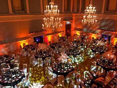 an overhead view of a banquet hall with many tables and chandeliers in it