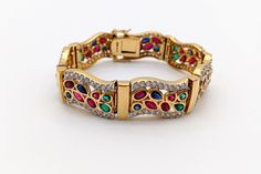 Vintage Chateau D'Argent Gold-Plated Sterling Silver Multi-Gemstone & Cubic Zirconia Bracelet This listing showcases a high-quality vintage 1990s Chateau D'Argent gold-plated sterling silver multi-gemstone & cubic zirconia bracelet. This bracelet, acquired from an estate sale, is in outstanding vintage condition with minimal wear and patina (please refer to the photos for details). The clasp is stamped "C^A 925 CANADA," which is the Chateau D'Argent maker's mark. *This item will be insured becau Luxury Diamond Jeweled Bracelets, Luxury Jeweled Bracelets In Cubic Zirconia, Luxury Jeweled Cubic Zirconia Bracelets, Gold Multi-stone Diamond Bracelet, Elegant Multicolor Hand Set Bracelets, Gold Cubic Zirconia Bracelet With Gemstone Accents, Elegant Multicolor Crystal Bracelet For Formal Events, Elegant Multicolor Crystal Bracelet For Formal Occasions, Gold Diamond Multi-stone Bracelets