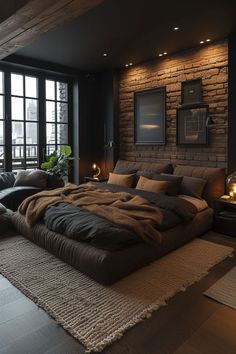 a large bed sitting in the middle of a living room next to a brick wall