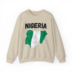 Celebrate the beauty and spirit of Nigeria with our Map of Nigeria Crewneck Sweatshirt, a trendy and stylish homage to this vibrant nation! Whether you're a proud Nigerian, have roots in Nigeria, or simply admire the rich culture and heritage of the country, this crewneck is a must-have addition to your wardrobe. Featuring a unique Nigeria flag art print, this crewneck showcases the unity and diversity of Nigeria. Crafted with a blend of polyester and cotton, our crewneck ensures a cozy and comfortable fit, making it perfect for both casual outings and cozy days. Stay on-trend with our Cute Nigeria Crewneck, designed for anyone who wants to showcase their love for Nigeria and its rich culture. The versatile design makes it suitable for all genders, adding a touch of elegance to your everyd Long Sleeve Flag Print Sweater For Fall, Fall Flag Print Long Sleeve Sweater, Fall Long Sleeve Flag Print Sweater, Fall Flag Print Crew Neck Sweater, Cotton Crew Neck Sweatshirt With Flag Print, Casual Long Sleeve T-shirt With Flag Print, Cotton Tops With Flag Print For Fall, Map Of Nigeria, Unity And Diversity