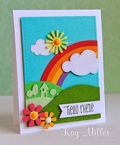 a card with a rainbow and flowers on it