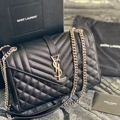 Saint Laurent Medium Monogram Quilted Leather Shoulderbag In Black And Silver Details Designer Crossbody Flap Bag, Luxury Flap Bag With Branded Hardware, Luxury Tan Flap Shoulder Bag, High-end Black Flap Bag For Business, Designer Flap Shoulder Bag For Everyday Luxury, Designer Luxury Flap Shoulder Bag, Tan Luxury Flap Bag, High-end Black Shoulder Bag, High-end Black Flap Bag With Dust Bag