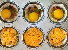 six muffin tins filled with different types of breakfast foods, including eggs and cheese