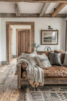 40 Country-Style Rustic Farmhouse Living Room Ideas Country Interior Living Room, Rustic Farmhouse Aesthetic, Rustic Brown Leather Couch, Rustic Farmhouse Living Room Paint Colors, Small Cozy Farmhouse Living Room, Farmhouse Living Room With Leather Couch, Rustic Livingrooms Sofas