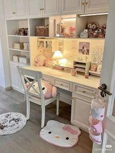 a white desk with hello kitty rugs on it