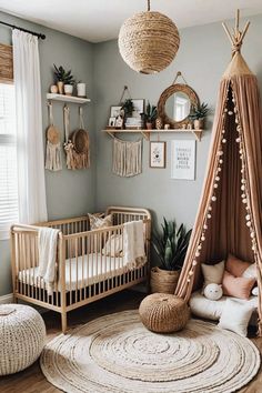 a baby's room with a teepee tent, crib and rugs